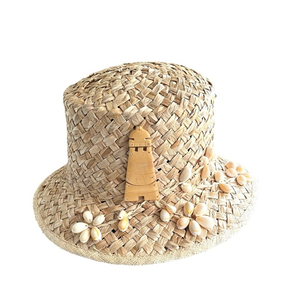 100% straw hat with shell and lighthouse embellishments